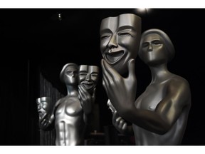FILE - In this Jan. 27, 2017 file photo, Screen Actors Guild "Actor" statues are pictured at the Shrine Auditorium in Los Angeles. The nominations for the 25th annual Screen Actors Guild Awards will be announced on Wednesday, Dec. 12.