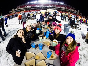Campers sit down for a little nourishment on Thursday, Dec. 6, 2018 before climbing into their tents at TD Place stadium for a chilly night at SleepOut for Youth. Anne Girard photo