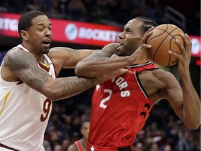 The Toronto Raptors' Kawhi Leonard (2) drives past the Cleveland Cavaliers' Channing Frye (9) on Saturday, Dec. 1, 2018, in Cleveland. Frye was called for the foul. The Raptors won 106-95.