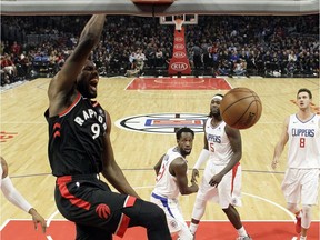 Toronto Raptors' Serge Ibaka (9) dunks against the Los Angeles Clippers during the second half of an NBA basketball game, Tuesday, Dec. 11, 2018, in Los Angeles.