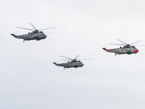 Photo shows Sea Kings conducting a flypast. Photo by LS Laurance Clarke.