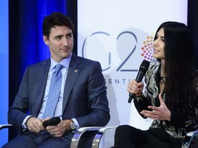 Prime Minister Justin Trudeau joins Shahrzad Rafati, CEO of BroadbandTV Corp, as they take part in a panel discussion at the Business Women Leaders Taskforce forum on the sidelines of the G20 Summit in Buenos Aires, Argentina on Thursday, Nov. 29, 2018.