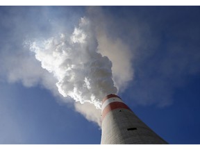 In this photo taken Wednesday, Oct. 3, 2018, smoke rises from the chimney of Serbia's main coal-fired power station near Kostolac, Serbia. Chinese companies are the world's largest investors in overseas coal plants. They are involved in the building of about a fifth of new coal-fired energy capacity around the world, mostly in the countries along its ambitious "Belt and Road" investment program which is seen in the West as an attempt by China to globally increase its political and economic influence.