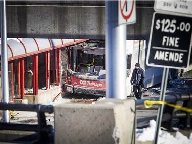 Ottawa police have the area around the Westboro transit station cordoned off with police tape and cruisers Saturday Jan. 12, 2019, while the collision is investigated. Three people were killed and many were injured after an OC Transpo double-decker bus crashed on the transit way Friday afternoon.