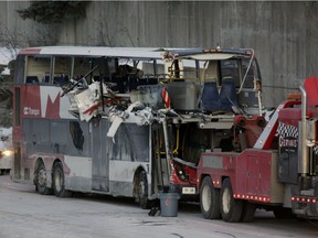 The OC Transpo bus that crashed Friday at Westboro Station was towed from the scene, revealing extensive damage, on Saturday.
