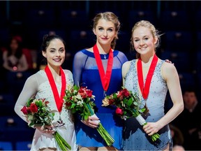 Ottawa figure skater Hannah Dawson, centre, won at the 2019 Canadian Tire National Skating Championships. At left is the second-place finisher, Oakville, Ont.'s Madeline Schizas, and at right is the third-place finisher, Reagan Scott of Lancaster, Ont.