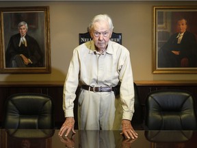 OTTAWA, ON. AUGUST 9, 2011 --- John P. Nelligan photographed in the boardroom at the firm which proudly displays his likeness (at left) on the walls.