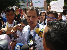 Venezuelan opposition leader and self-proclaimed interim president Juan Guaido talks to the media during a demonstration against the government of President Nicolás Maduro on Jan. 30 in Caracas, Venezuela.