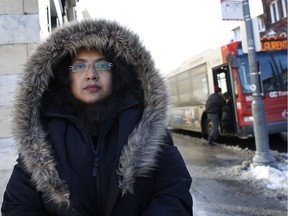 Shamsia Quraishi, a survivor of the OC Transpo-Via Rail crash in September 2013, photographed next to a bus stop on Bank St. in 2014.