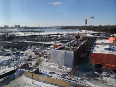 The two tarped buildings on the right are being restored and are expected to be released for commercial use later this year. A glass atrium between the two will cover a four-season patio that will form the beginning of a linear park that lines up with Parliament Hill.