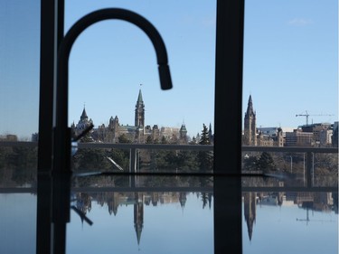 The kitchen faucet in the model suite at Zibi frames the Peace Tower, emphasizing the exceptional views the project commands.