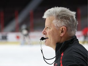 Ottawa Senators interim head coach Marc Crawford watches a play during practice.