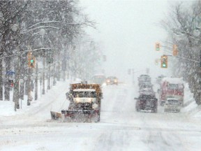 Snowplow in a snowstorm on Wellington Street in Ottawa, January 23, 2019.