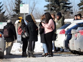 Students of Carleton University wait outside of their building after a false locked down on campus, January 28, 2019.