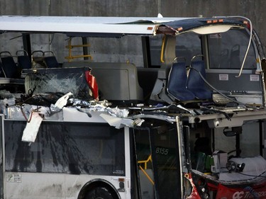 The OC Transpo bus involved in Friday's crash at Westboro Station was towed from the scene, revealing extensive damage, on Jan. 12, 2019.