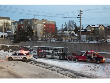 The OC Transpo bus involved in Friday's crash at Westboro Station was towed from the scene, revealing extensive damage, on Jan. 12, 2019.