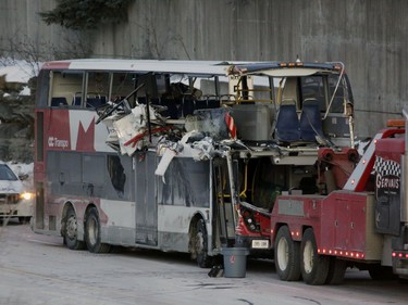 The OC Transpo bus involved in Friday's crash at Westboro Station was towed from the scene, revealing extensive damage, on Jan. 12, 2019.