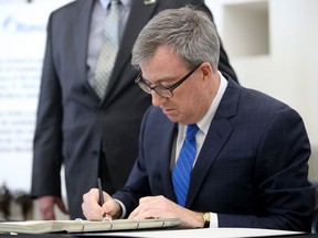 Ottawa Mayor Jim Watson was the first to sign a book of condolences in memory of the victims of Friday's Westboro bus crash at Ottawa City Hall on Monday. The book is open to the public to sign until Sunday.