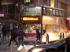 Commuters board OC Transpo's #269, the same type of bus and the same route in Friday's crash, as it makes it's way westward down Albert Street near Metcalfe Tuesday.