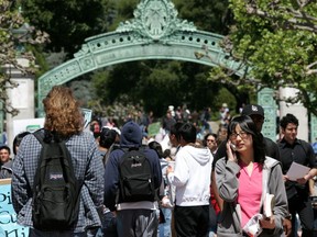 UC Berkeley students walk through Sather Gate on the UC Berkeley campus in Berkeley, California.