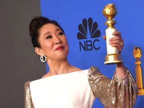 Host and Best Performance by an Actress in a Television Series  Drama "for Killing Eve" winner Sandra Oh poses with the trophy during the 76th annual Golden Globe Awards on January 6, 2019, at the Beverly Hilton hotel in Beverly Hills, California.