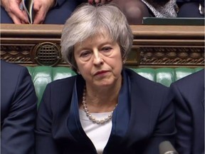 A video grab from footage broadcast by the UK Parliament's Parliamentary Recording Unit (PRU) shows Britain's Prime Minister Theresa May reacting as Labour Party leader Jeremy Corbyn informs the MPs that he has tabled a vote of no confidence in the Government in the House of Commons in London on January 15, 2019, after MPs voted to reject the government's Brexit deal. - British lawmakers voted overwhelmingly Tuesday to reject the EU divorce deal struck between London and Brussels, in a historic vote that leave Brexit hanging in the balance.