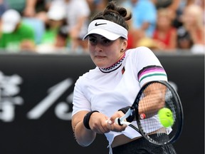 Canada's Bianca Andreescu hits a return against Latvia's Anastasija Sevastova during their women's singles match on day four of the Australian Open tennis tournament in Melbourne on January 17, 2019.