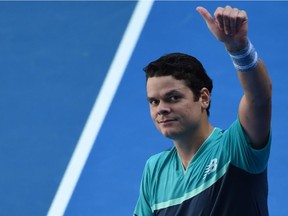 Canada's Milos Raonic celebrates after victory over France's Pierre-Hugues Herbert during their men's singles match on day six of the Australian Open tennis tournament in Melbourne on January 19, 2019.