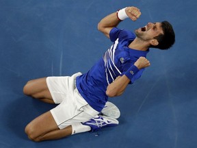 Serbia's Novak Djokovic celebrates after defeating Spain's Rafael Nadal in the men's singles final at the Australian Open tennis championships in Melbourne, Australia, Sunday, Jan. 27, 2019.(AP Photo/Mark Schiefelbein) ORG XMIT: MEL214