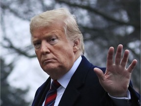 President Donald Trump walks on the South Lawn upon arrival at the White House in Washington, Saturday, Jan. 19, 2019, after attending the casualty return at Dover Air Force Base, Del., for the four Americans killed in a suicide bomb attack in Syria.