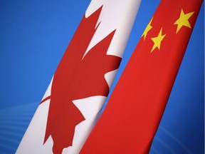 Flags of Canada and China.