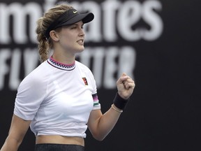 Canada's Eugenie Bouchard celebrates after defeating China's Peng Shuai in their first round match at the Australian Open tennis championships in Melbourne, Australia, Tuesday, Jan. 15, 2019.