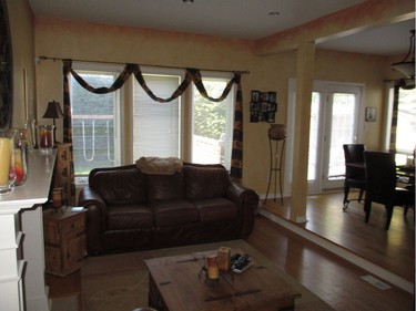 BEFORE: The colonial-style home was built in the late 1990s. With a yellow-palette throughout and reddish-wood flooring, the space looked washed out and dated.