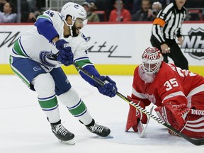 Darren Archibald drives to the net against the Red Wings during a Canucks game on Nov. 6.