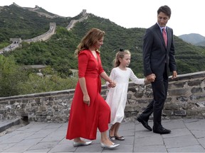 Prime Minister Justin Trudeau, his wife Sophie Gregoire, and daughter Ella-Grace walk along a section of the Great Wall of China in 2016. That was before relations started to crumble.