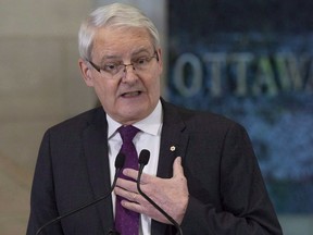 Transport Minister Marc Garneau said the work required to develop new safety standards for transit buses would be complicated.