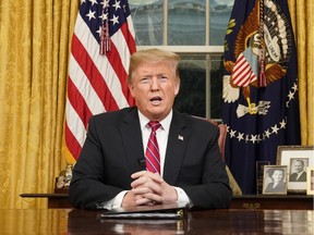 President Donald Trump speaks from the Oval Office of the White House on Tuesday night.