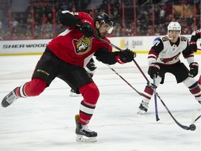 Arizona Coyotes centre Clayton Keller  looks on as Ottawa Senators left wing Nick Paul breaks his stick taking a shot during second period NHL action in Ottawa, Tuesday.