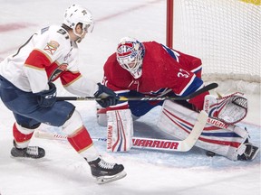 Montreal Canadiens goaltender Antti Niemi (37) makes the save on Florida Panthers right wing Juho Lammikko (91) during first period NHL hockey action Tuesday, January 15, 2019 in Montreal.