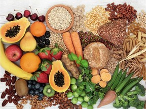 Food with high fiber content for a healthy diet with fruit, vegetables, whole wheat bread, pasta, nuts, legumes, grains and cereals. High in antioxidants, anthocyanins, vitamins and omega 3 fatty acid.