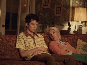 This image released by Netflix shows Asa Butterfield, left, and Gillian Anderson in a scene from "Sex Education."