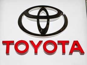FILE- In this Feb. 15, 2018, file photo the Toyota logo displayed at the Pittsburgh Auto Show. Toyota is recalling 1.7 million vehicles in North America to replace potentially deadly Takata front passenger air bag inflators. The move announced Wednesday, Jan. 9, 2019, includes 1.3 million vehicles in the U.S. and is part of the largest series of automotive recalls in the nation's history.