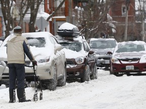 A senior citizen walks on snow covered streets in Ottawa on Tuesday Jan 29, 2019.