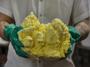 Alliston Creamery employees churn and package Emerald Grasslands butter at the Alliston, Ontario location, Wednesday December 19, 2018.