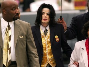 FILE - In this May 25, 2005 file photo, Michael Jackson arrives at the Santa Barbara County Courthouse for his child molestation trial in Santa Maria, Calif. A documentary film about two boys who accused Michael Jackson of sexual abuse is set to premiere at the Sundance Film Festival later this month. The Sundance Institute announced the addition of "Leaving Neverland" and "The Brink," a documentary about Steve Bannon, to its 2019 lineup on Wednesday. The Sundance Film Festival kicks off on Jan 24 and runs through Feb. 4. (Aaron Lambert/Santa Maria Times via AP, Pool) ORG XMIT: NYET311