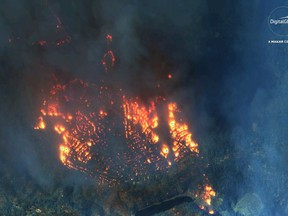 This Nov. 9, 2018 satellite image provided by DigitalGlobe shows fires consuming Paradise, Calif.