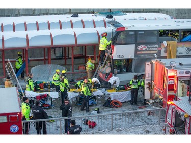 First responders attend to victims of a horrific rush hour bus crash at the Westboro Station near Tunney's Pasture.