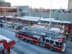 First responders attend to victims of a horrific rush hour bus crash at the Westboro Station near Tunney's Pasture.