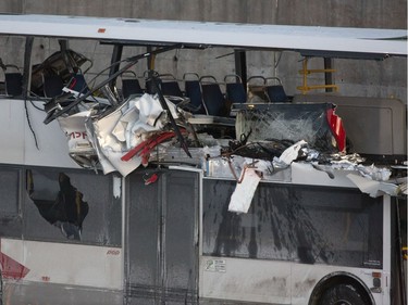 The OC Transpo bus involved in Friday's crash at Westboro Station was towed from the scene, revealing extensive damage, on Jan. 12, 2019.