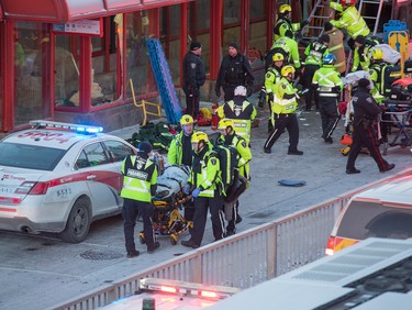 First responders attend to victims of a horrific rush hour bus crash at the Westboro Station near Tunney's Pasture.